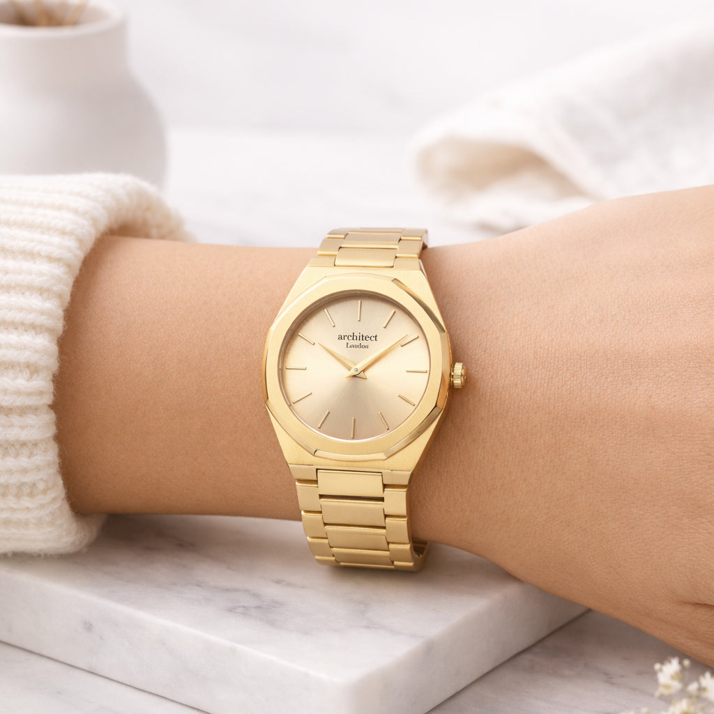 Gold ladies personalised watch on a person's arm with a blurred background