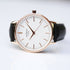Minimalist ladies rose gold watch with white dial and black leather strap