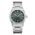 Silver watch with a green face on a white background